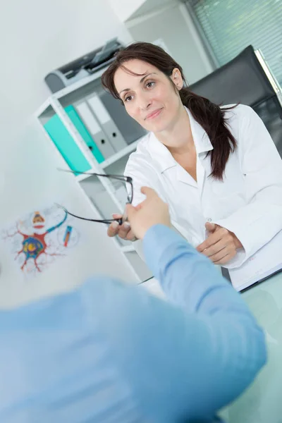 Removing the eyeglasses and work — Stock Photo, Image