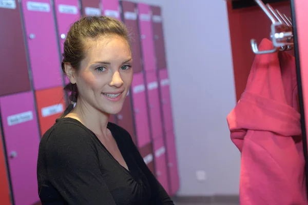 Fitness young beautiful smiling woman in dressing room — Stock Photo, Image