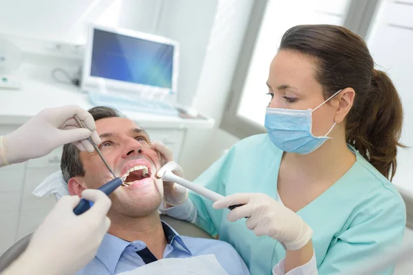 Man having dental treatment — Stock Photo, Image