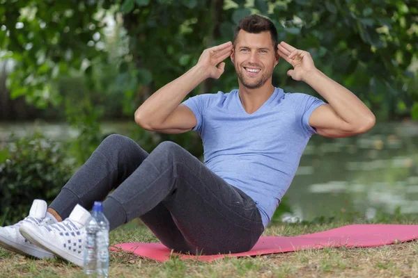 Young handsome athlete in nature — Stock Photo, Image