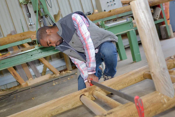 Man working in woodyard — Stock Photo, Image