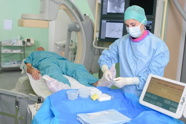 Patient on modern operating room with surgeon Royalty Free Stock Images