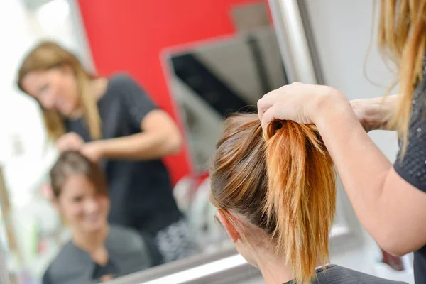 Having her hair styled — Stock Photo, Image