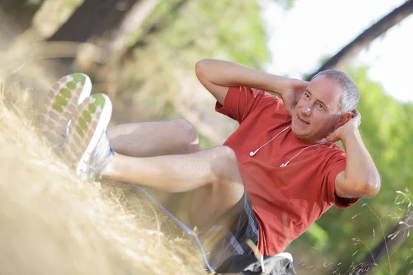 Middle-aged man working out outside — Stock Photo, Image