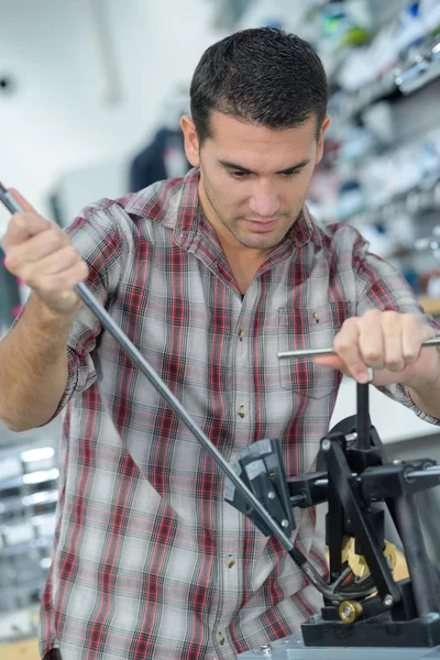 Male customer buying accessories in music store — Stock Photo, Image