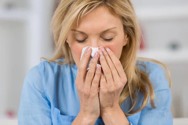 Woman covering her nose — Stock Photo, Image