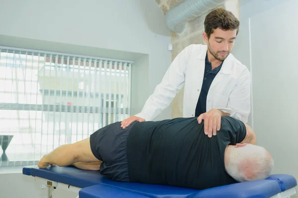 Senior man at a physio therapy — Stock Photo, Image