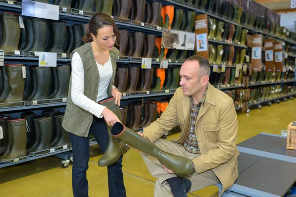 Customer buying wellington boots