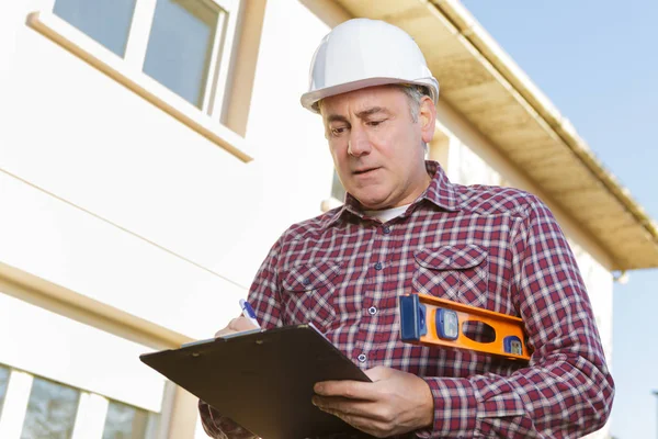 Construção trabalhador planejamento empreiteiro desenvolvedor conceito — Fotografia de Stock