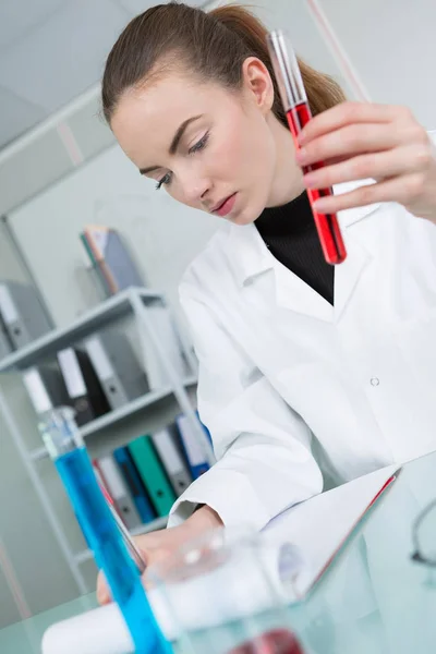 Female doctor with blood sample — Stock Photo, Image