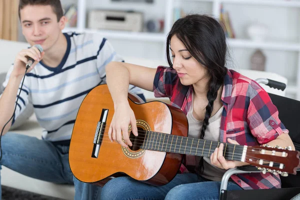 Friends playing guitar and two — Stock Photo, Image