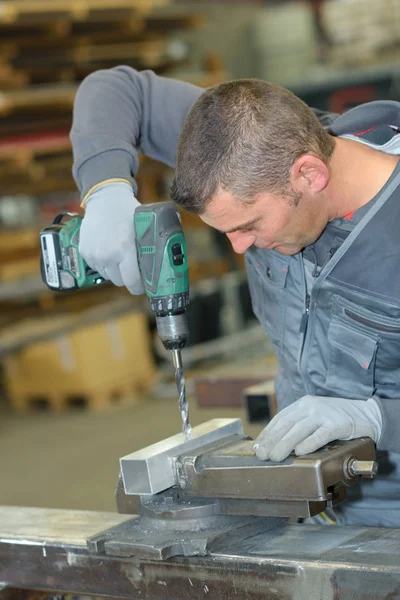 Drilling on a steel bar — Stock Photo, Image