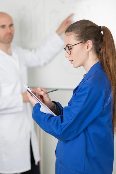 Professor with female student in modern school classroom — Stock Photo, Image