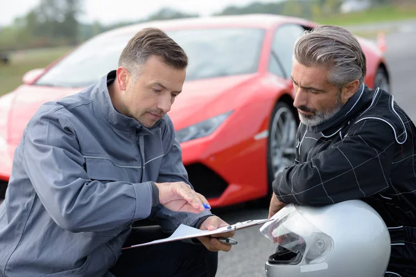 professional car driver with coach