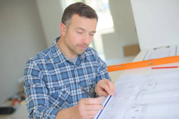 Architect drawing and architect — Stock Photo, Image