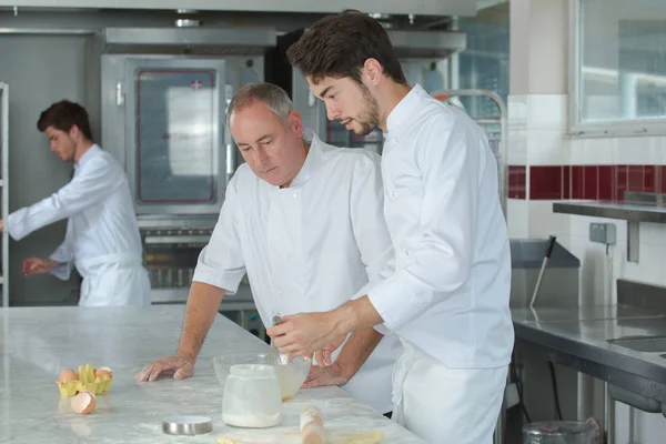 Chefs at work and chef — Stock Photo, Image