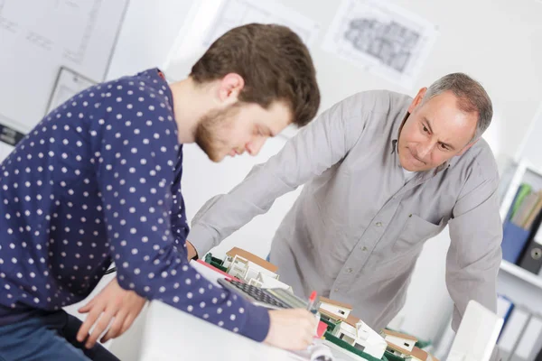 Students in architecture class with trainer Royalty Free Stock Photos