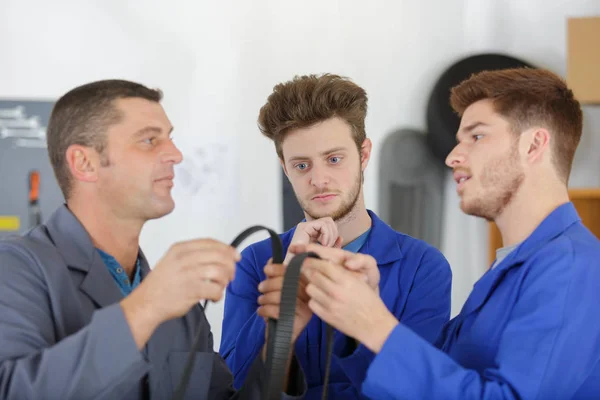 Man with apprentices and apprentice — Stock Photo, Image