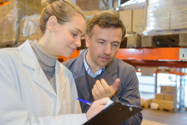 stock image female and male worker at warehouse