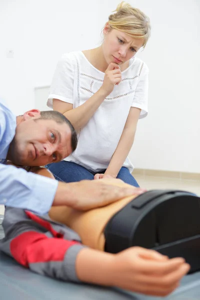 Man learning how to make hands for heart compressions — Stock Photo, Image