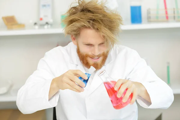 mad scientist mixing coloured liquids