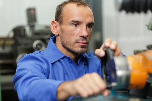 Portrait of mechanic in overall at work — Stock Photo, Image