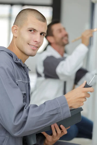 Young house painter looking at the camera — Stock Photo, Image