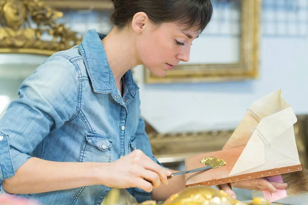 Portrait of woman on frame restoration — Stockfoto