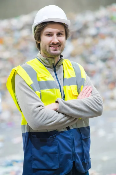 Engineer standing in front of an factory building — ストック写真