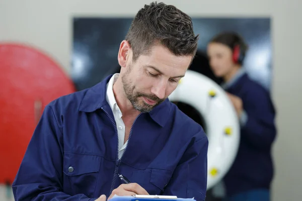 Male worker of aircraft manufacturing company busy at work — Stock Photo, Image