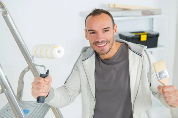 Smiling male painter at work — Stock Photo, Image