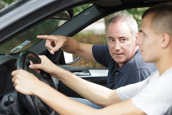 Dad and son - first test drive — Stock Photo, Image