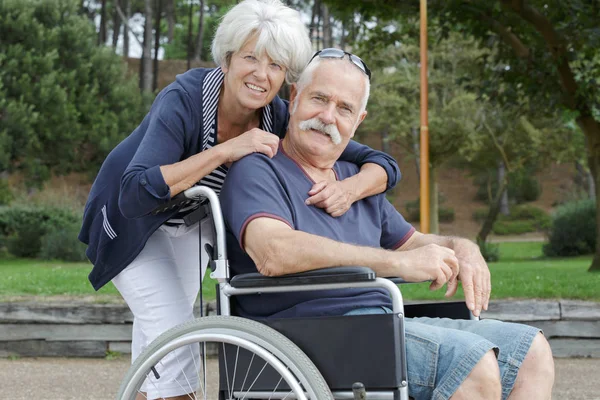Happy old couple in the park Stock Image