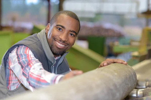 Worker holding a cement pipe — Stock Photo, Image