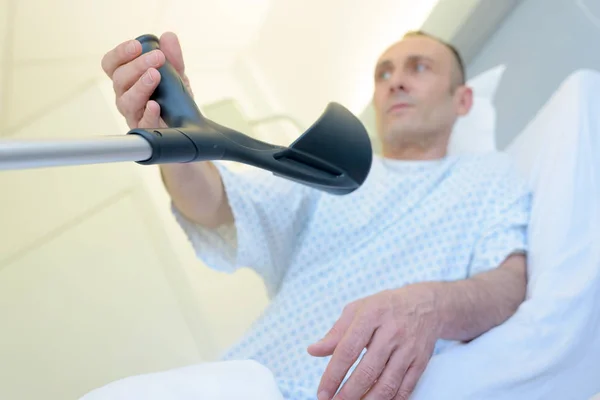 Man on crutches with injured foot collage — Stock Photo, Image