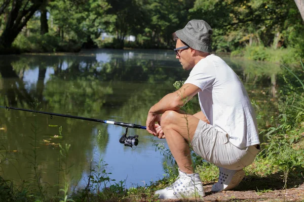 A lonely fisherman and man — Stock Photo, Image