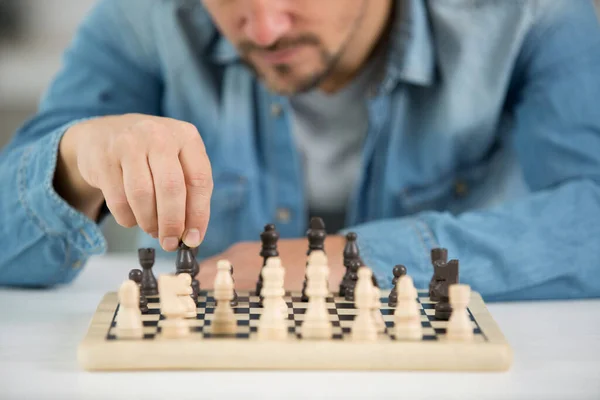 Man Playing Wooden Chess Alone — Stock Photo, Image