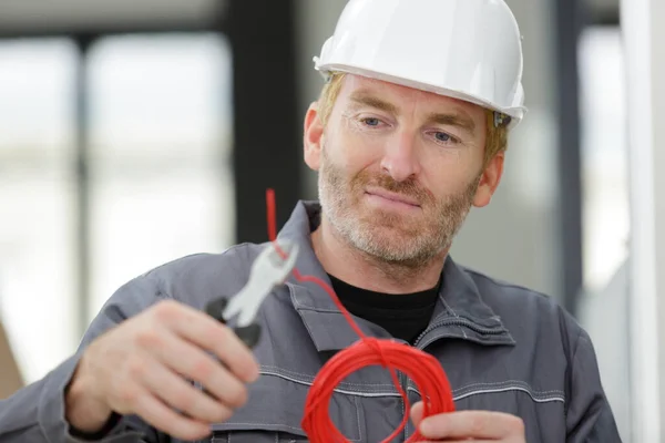 Contractor Cutting Red Cable Cable Cutter Pliers — Stock Photo, Image