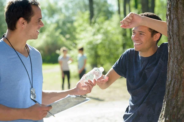 Coach Giving Water Man — Stock Photo, Image