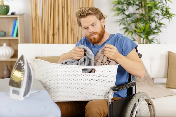 Happy Man Wheelchair Dealing Laundry Basket — Stock Photo, Image