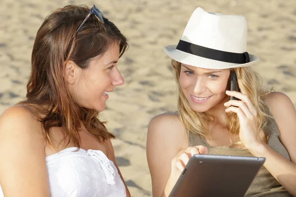 Two Attractive Beautiful Women Tablet Beach — Stock Photo, Image