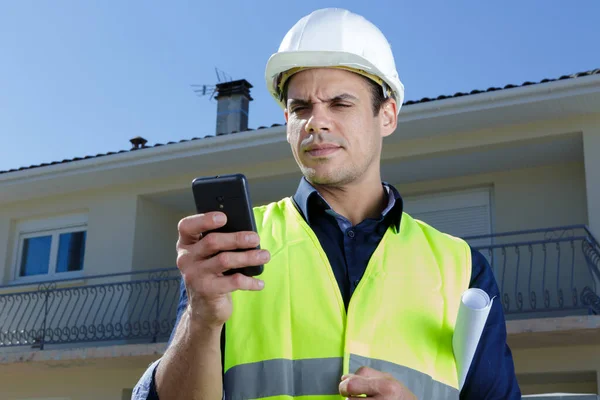 Bauarbeiter Spricht Über Arbeit — Stockfoto