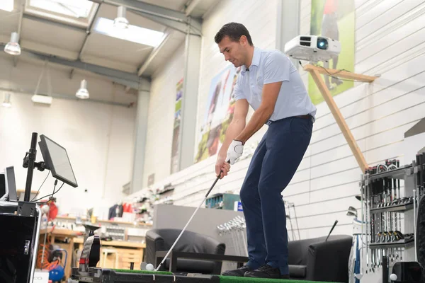 Man Testing Golf Club Shop — Stock Photo, Image