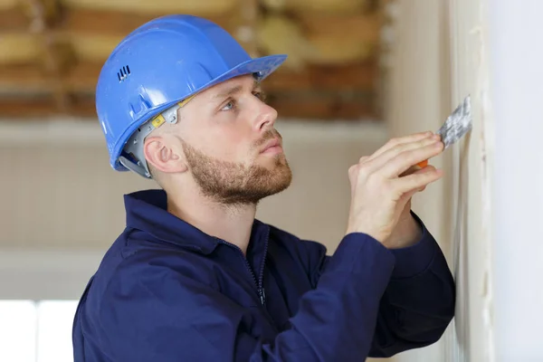 Construction Worker Long Trowel Plastering Wall — Stock Photo, Image