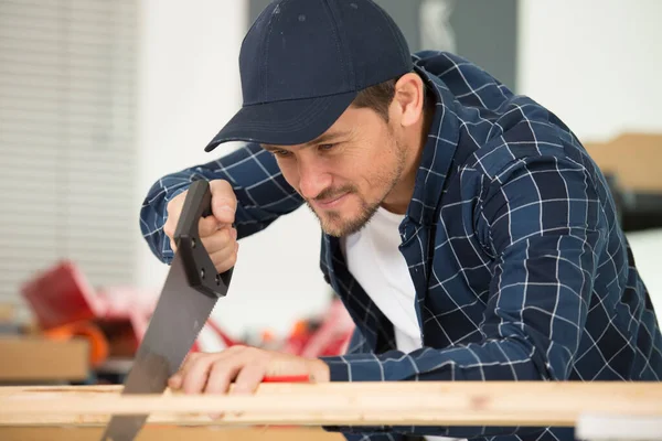 Carpenter Focusing Sawing Timber — Stock Photo, Image