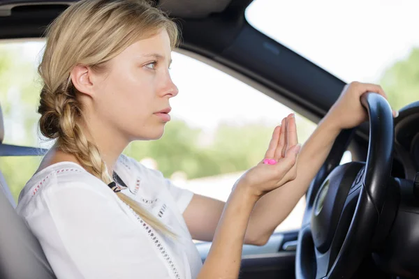 Woman Holds Tablets While Steering Wheel Car — Stock Photo, Image