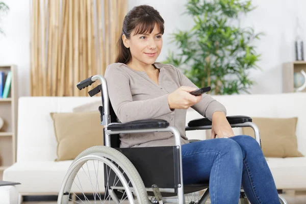 Young Disabled Lady Using Remote Control — Stock Photo, Image