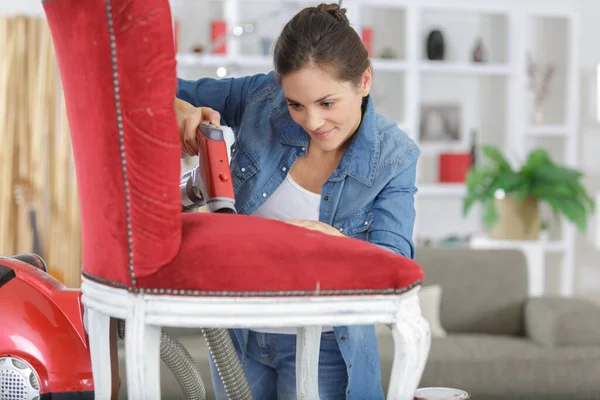 Woman Fixing Chair Staple — Stock Photo, Image