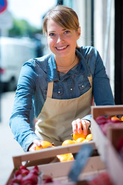 Friendly Young Happy Seller Ooking Camera — Stockfoto