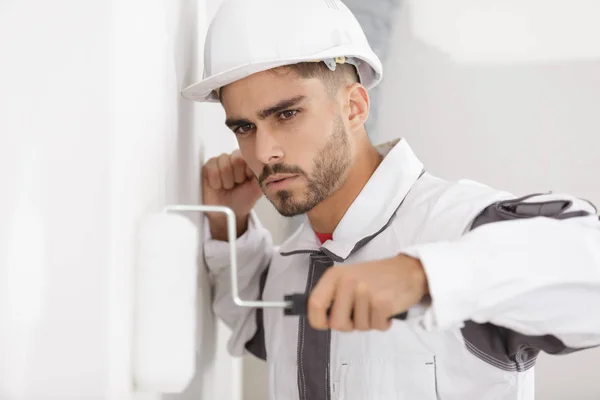 Man Constructor Helmet Plastering Wall Rolle — Stock Photo, Image